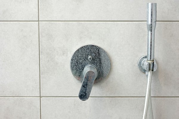 How do you prevent limescale buildup in UK regions with hard water?